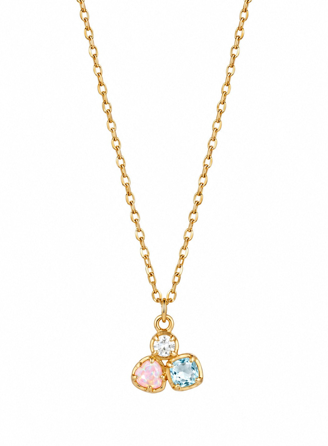 Gold necklace with three colorful gemstones on a white background