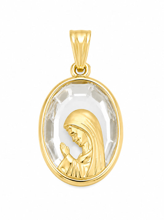 A gold pendant featuring a raised profile of the Virgin Mary in prayer, set within a clear Austrian clear faceted oval crystal frame, on a plain white background.