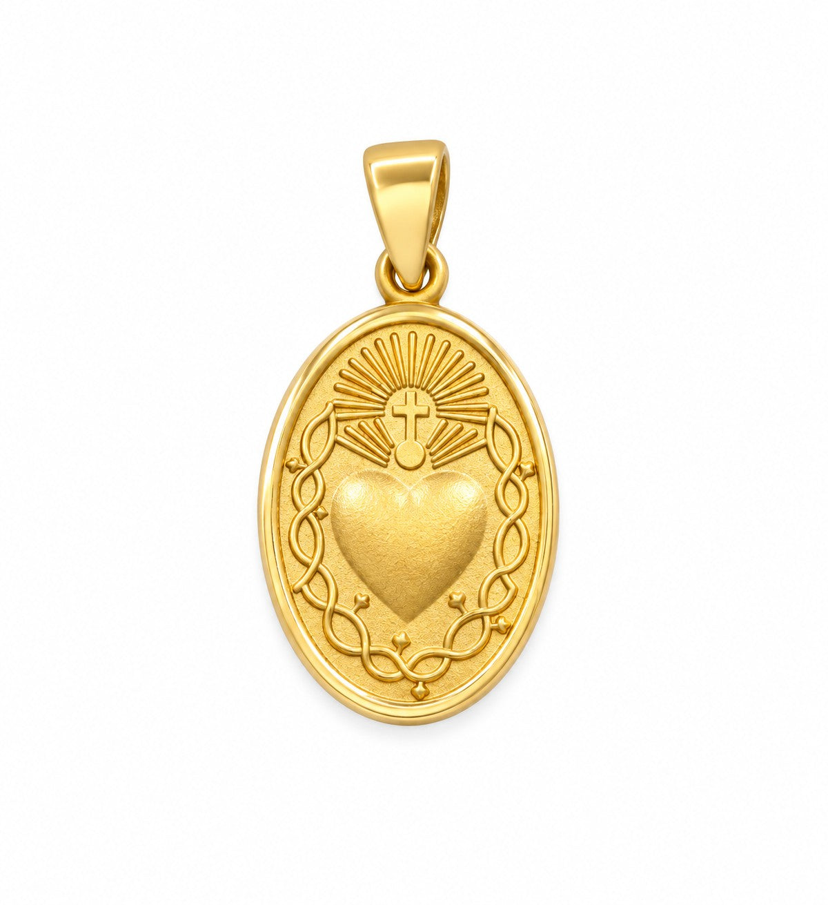 A gold oval pendant featuring the Sacred Heart of Jesus, with a textured heart at the center, a radiant sunburst, and a decorative wreath border, shown on a plain white background.