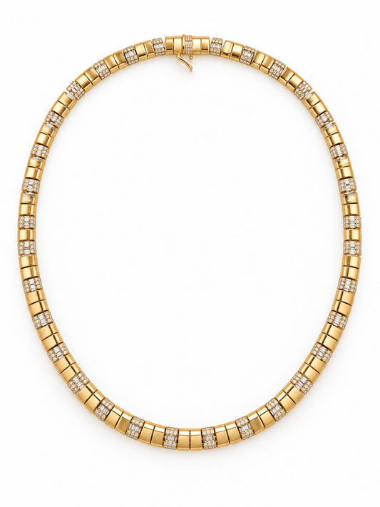 A yellow gold modern contemporary tennis necklace featuring rows of small Baguette and round cut Diamond stones set between larger polished gold rectangular links, displayed on a clean white background.