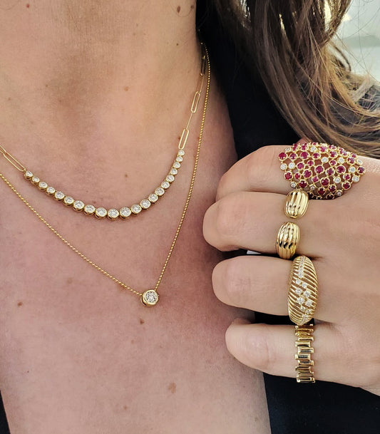 Golden Glow: 14K Gold Riviera Bezel Graduated Diamond Paperclip Necklace