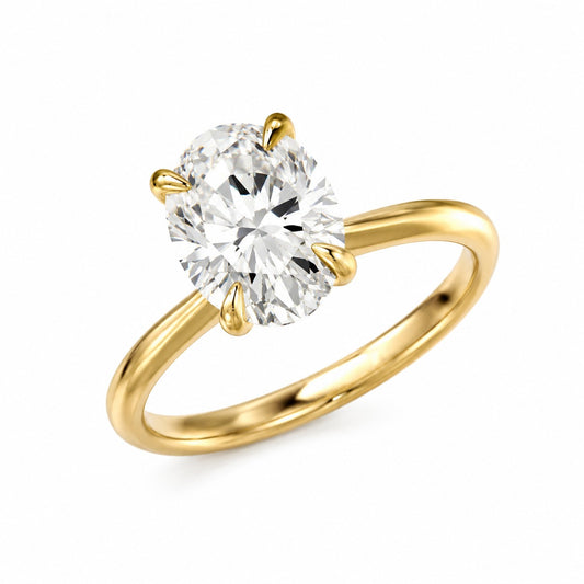 A yellow gold solitaire engagement ring featuring an oval-cut lab grown diamond gemstone in a four-prong setting, shown on a clean white background.